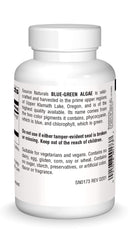 Source Naturals blue-green algae tablets closeup ready to swallow