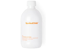 SpoiledChild liquid collagen mango bottle on counter, supporting skin and hair health.