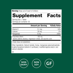 Standard Process E-Manganese tablet closeup showing manganese and vitamin E for health function.