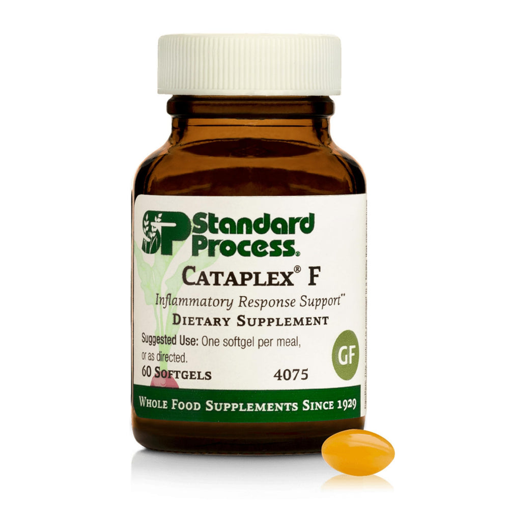 Standard Process Flax Oil Plus bottle on desk for hair and skin support