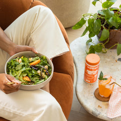 Scoop of Supergut powder ready to blend into a smoothie