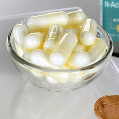 Swanson NAC capsules inside bottle for easy daily use.