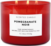 T&H Pomegranate Noir Vanilla 3 wick candle in focus, bold fragrance for living room use