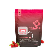 Tailwind Recovery Mix strawberry being poured into a bottle for post-workout hydration.