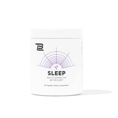 TB12 Sleep bottle on a nightstand promotes calm pre-bed routine.