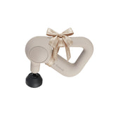TheraGun Relief handheld massage gun in sand color for quick muscle relief.