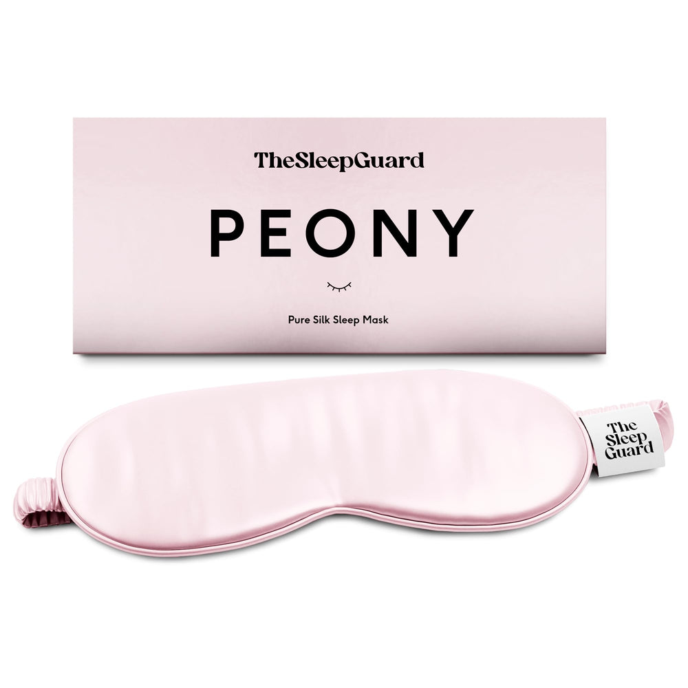 TheSleepGuard pure silk sleep mask in black blocks light for deeper rest.