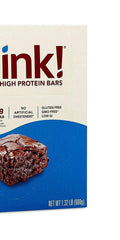 ThinkThin Brownie Crunch bar in hand—convenient, wheat-free snack for busy moms.