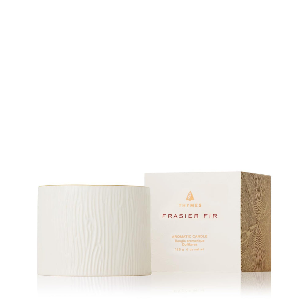 Thymes Frasier Fir candle in a wood grain ceramic jar for a premium winter look