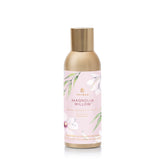Thymes Magnolia Willow fragrance mist bottle refreshing a room.