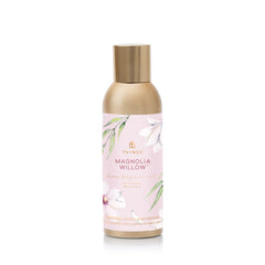 Thymes Magnolia Willow fragrance mist bottle refreshing a room.
