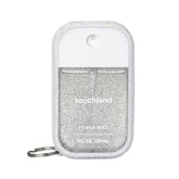 Touchland Confetti Cake sanitizer bottle pour for quick on-the-go hydration.