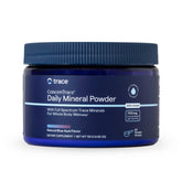 Trace Minerals ConcenTrace Daily Mineral Powder being poured into a glass for hydration support.