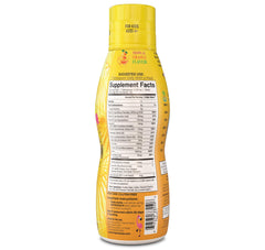Tropical Oasis liquid multivitamin for kids being poured into a measuring spoon