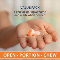 TRUEplus orange glucose tablets orange flavor cue beside the bottle.