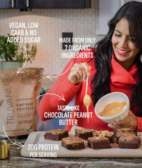 Truvani scoop with powder ready for smoothie blends, highlighting organic ingredients.