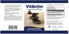 VITÄLZYM multi-enzyme capsules close-up with bromelain and papain.