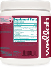 Pouring Wellah Creatine for Women powder into a glass.