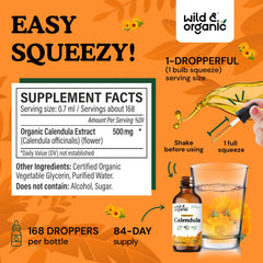 Wild and Organic calendula tincture amber glass bottle close-up with antioxidant label.