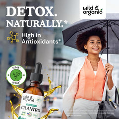 Pouring cilantro tincture from bottle for convenient daily use.