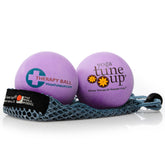 Yoga Tune Up therapy balls in tote for targeted muscle release and portability.