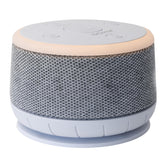 Yogasleep Dohm Nova white noise machine on nightstand delivering bedtime calm
