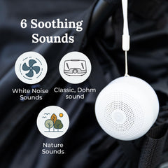 YOGASLEEP Travel Mini amber night light provides soft, non-disruptive illumination.