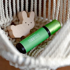 Young Living KidScents TummyGize roll-on being applied on skin for quick routine.