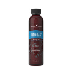 Young Living Ortho Ease Massage Oil bottle pour for soothing post-workout relief.