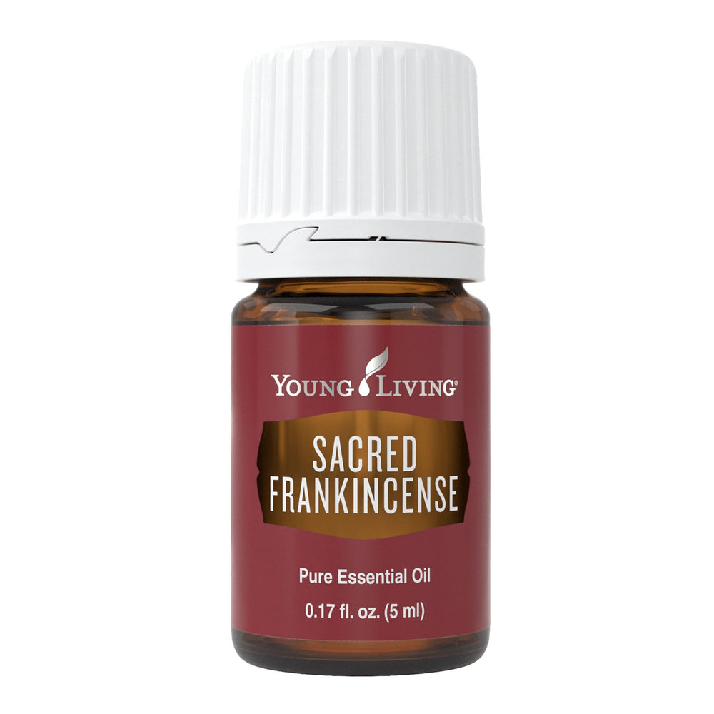 Young Living Sacred Frankincense essential oil bottle; soothing, woodsy aroma for mindfulness rituals.