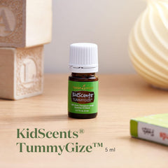 Young Living TummyGize bottle label close-up highlighting peppermint, tangerine, and ginger for tummy comfort