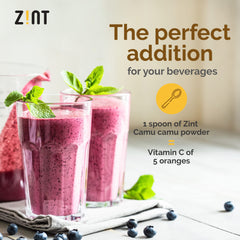 Pouring Zint Camu Camu powder into juice for natural support.