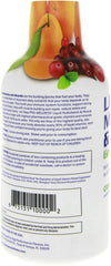 Pouring Citrus Burst liquid multivitamin for a quick morning boost.
