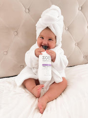 Zoey Naturals kid in tub visual hints at tear-free bedtime routines.