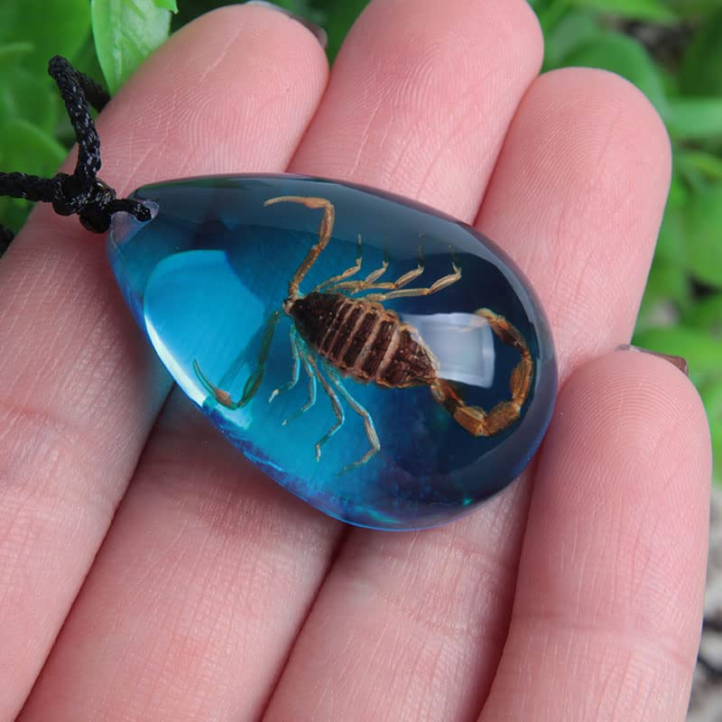 Resin-based amber pendant emphasizes handcrafted artistry and warm tones