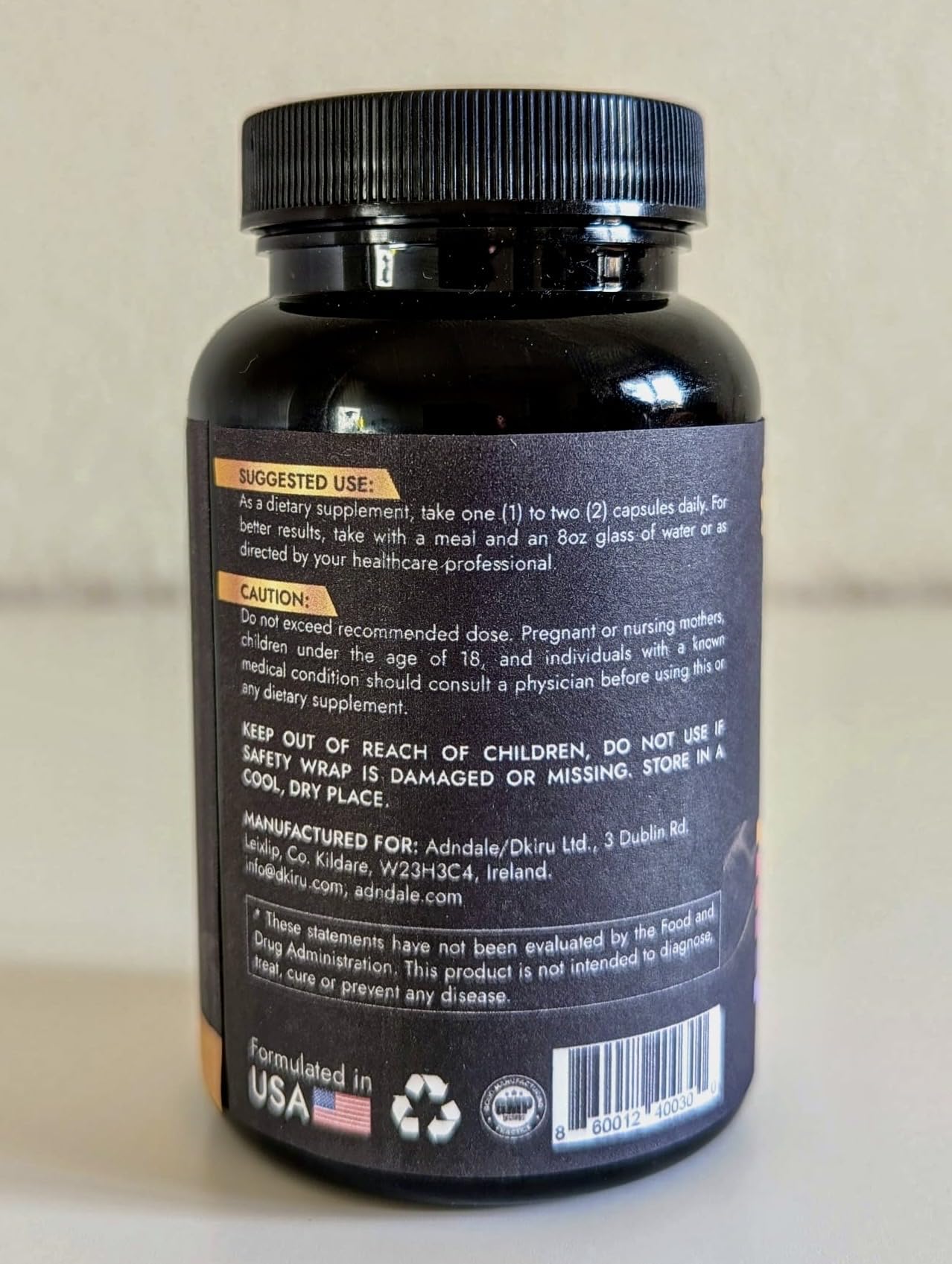 Adndale NAD Resveratrol capsule closeup emphasizes rounded shells and compact form.