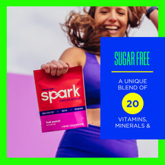 AdvoCare Spark on-the-go packet beside phone for travel-friendly boost.