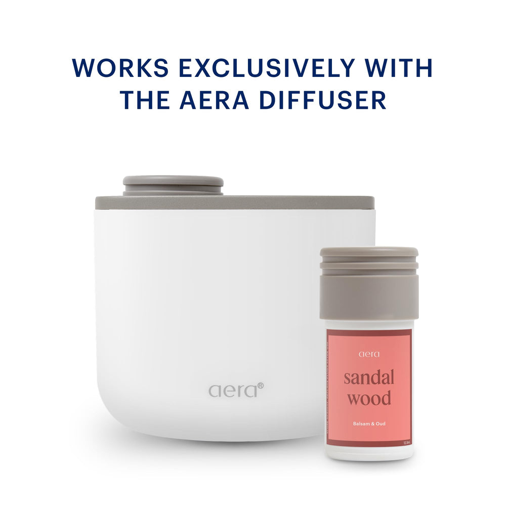 Aera Mini Sandalwood bottle displays lime and orange notes for a refreshing aroma.