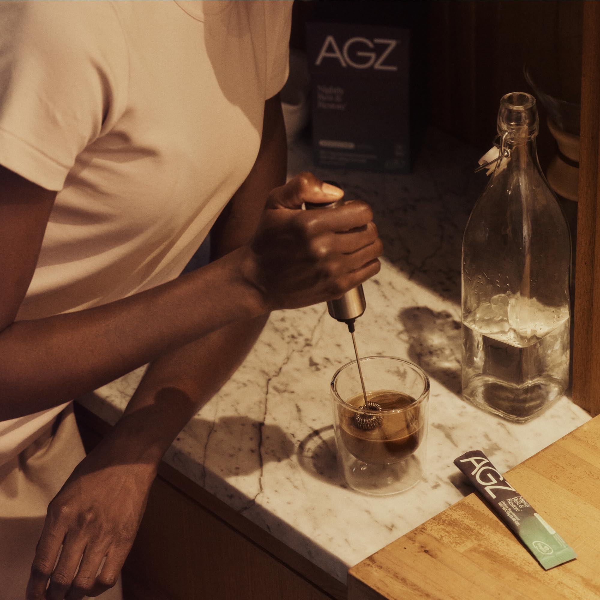 AG1 AGZ Sleep Drink Sampler glass with ice and a pour
