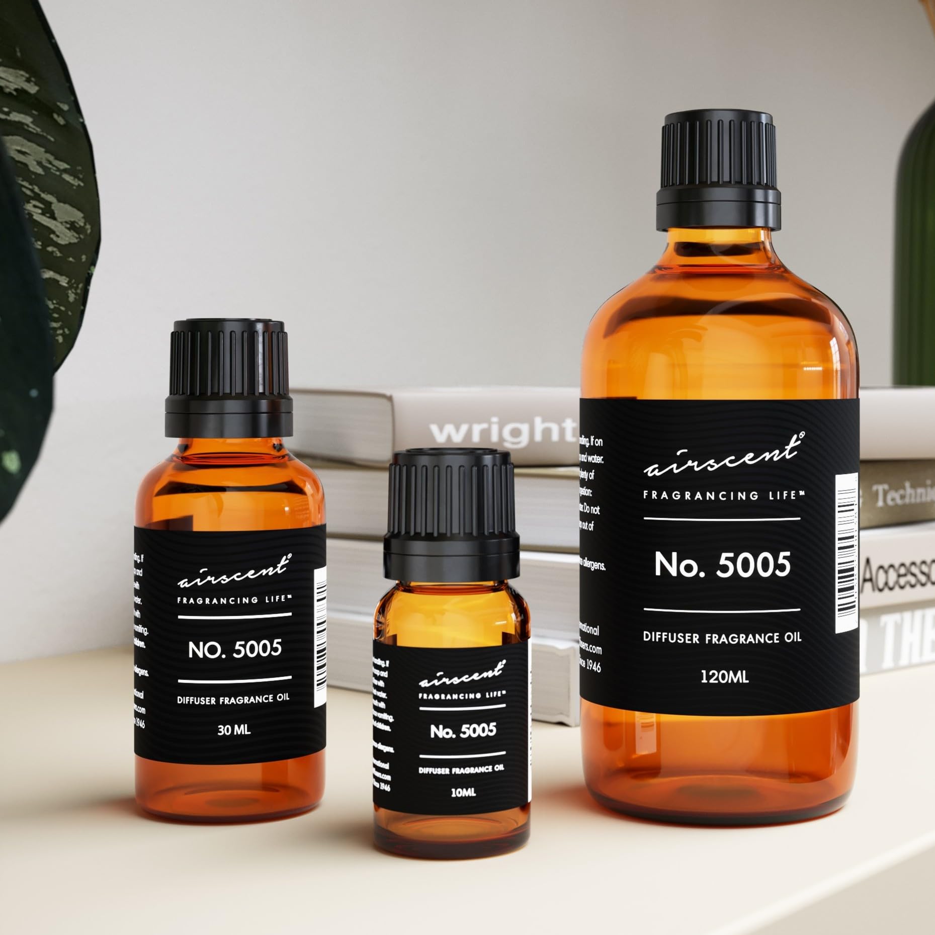 Air-Scent Oud Wood bottle glows on shelf for ambience