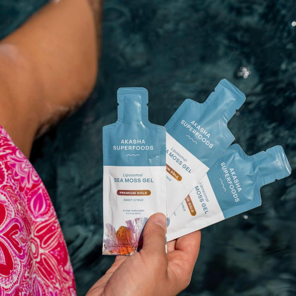 Akasha Superfoods gel being added to a glass of water