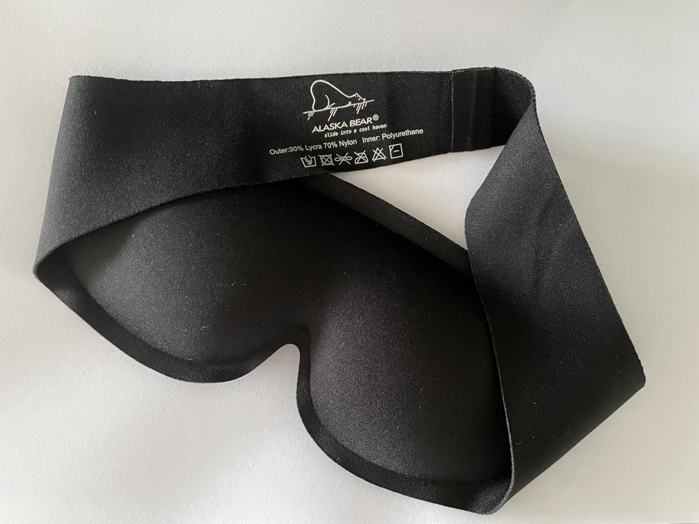 Mascarilla Alaska Bear para viajes y vuelos nocturnos con oscuridad suave.