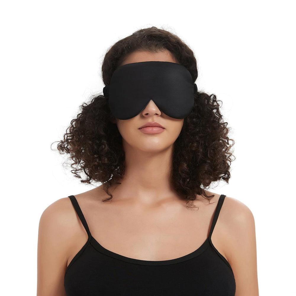 ALASKA BEAR sleep mask shown in travel setup for on-the-go use.