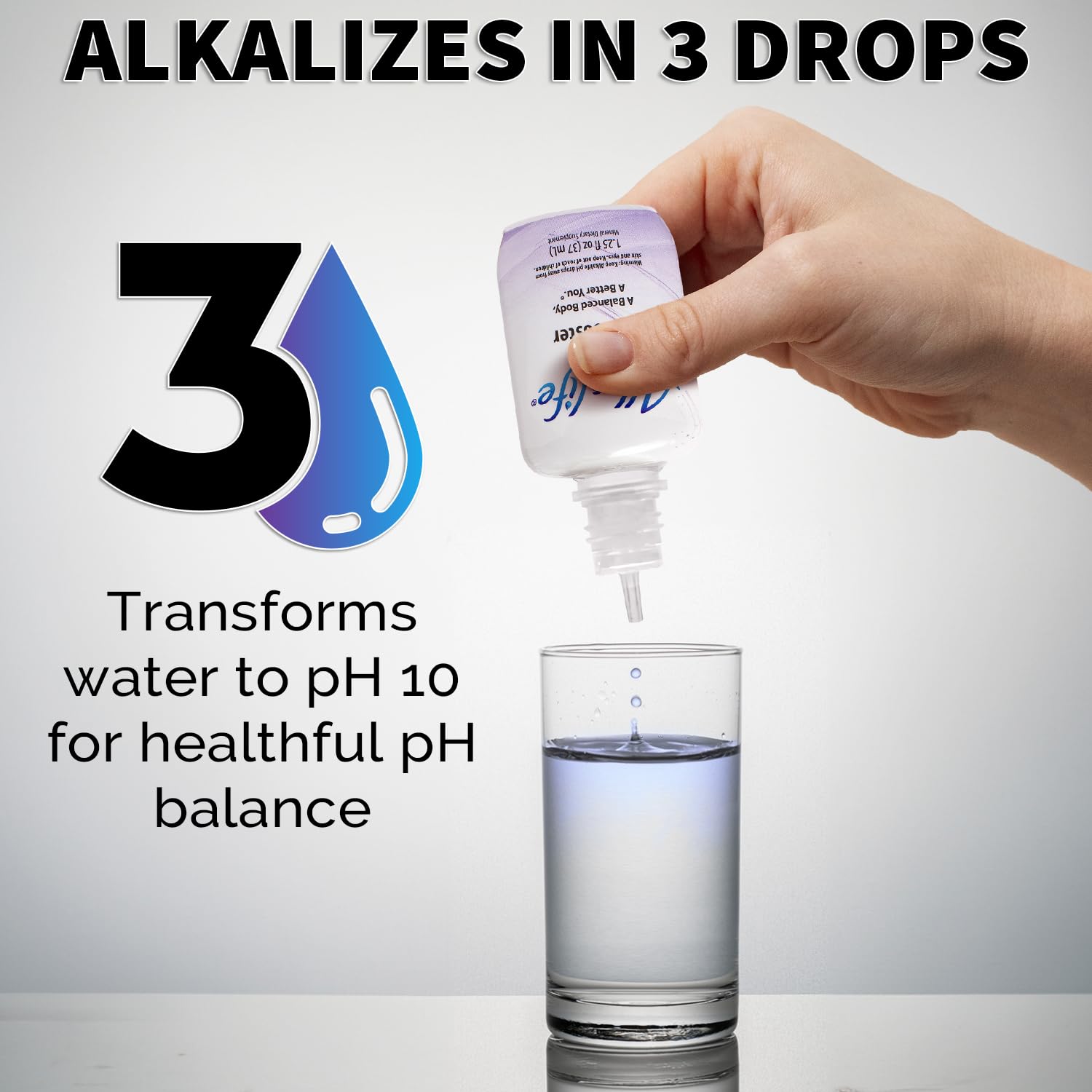 Glass and bottle of Alkalife Drops ready for alkaline water.