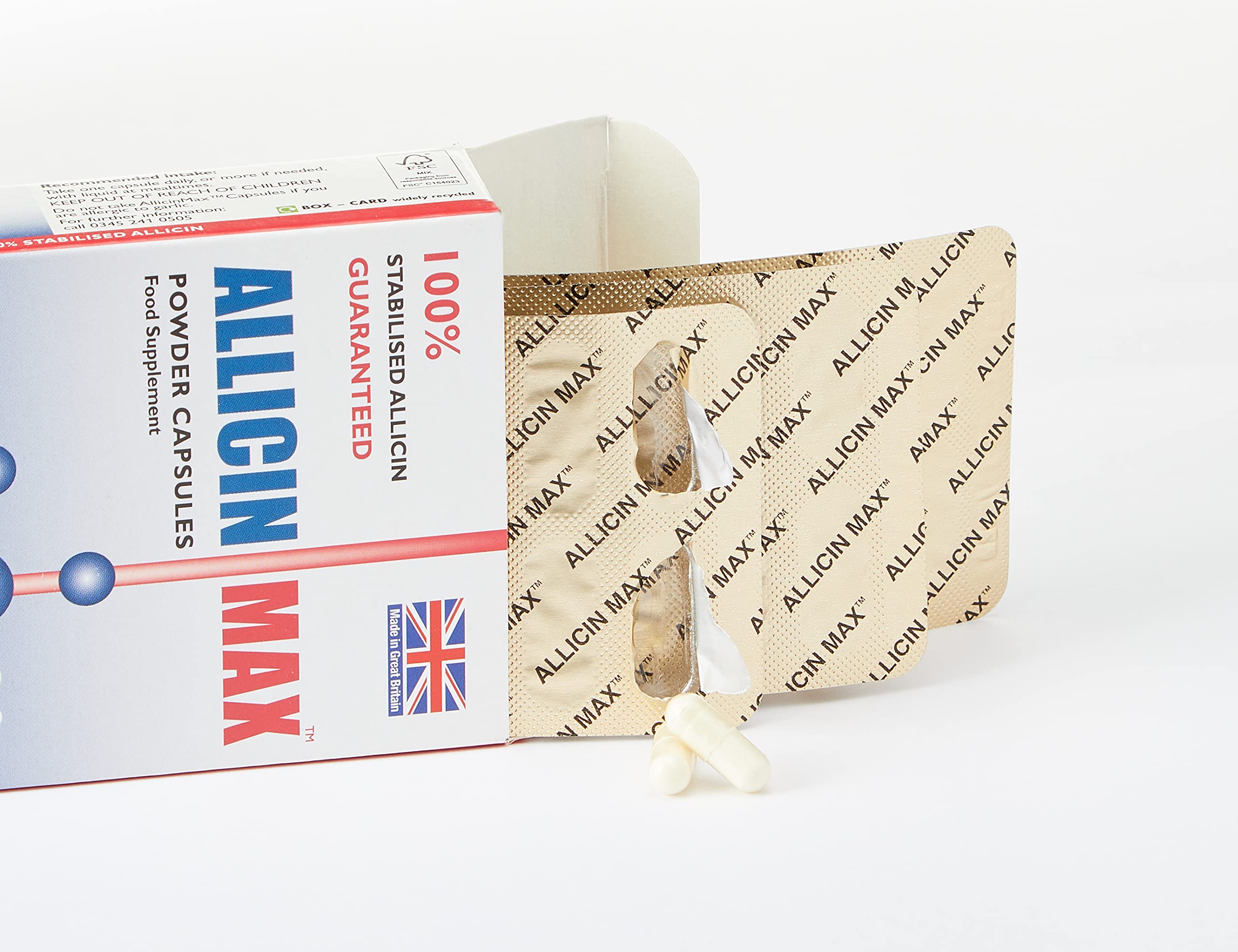 Close-up of AllicinMax capsules highlighting vegan, easy-to-swallow design.