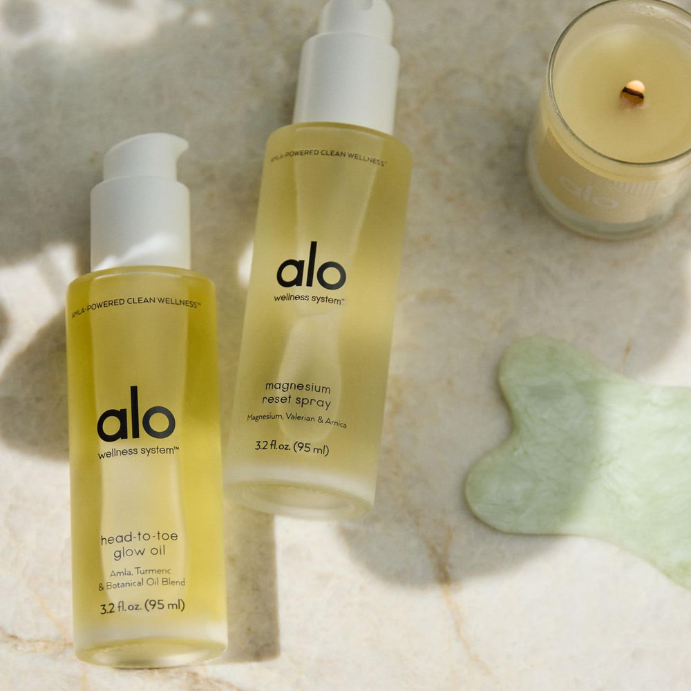 Alo Magnesium Reset spray mist on forearm during wind-down ritual
