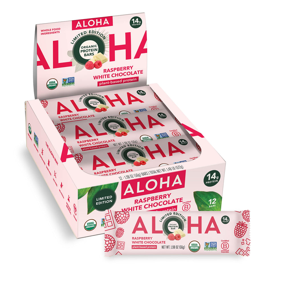 ALOHA Raspberry White Chocolate bar on wood surface, a vegan, gluten-free snack option.