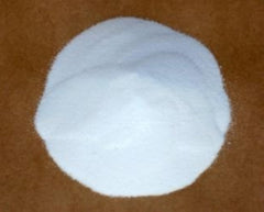 Alpha Chemicals Zinc Sulfate Monohydrate granules close-up highlighting purity and strength.