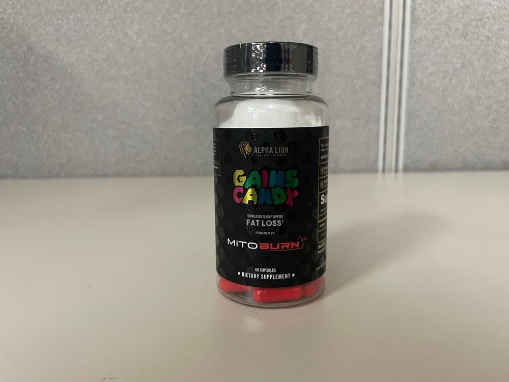 Pouring capsules into hand for quick dose with Gains Candy.