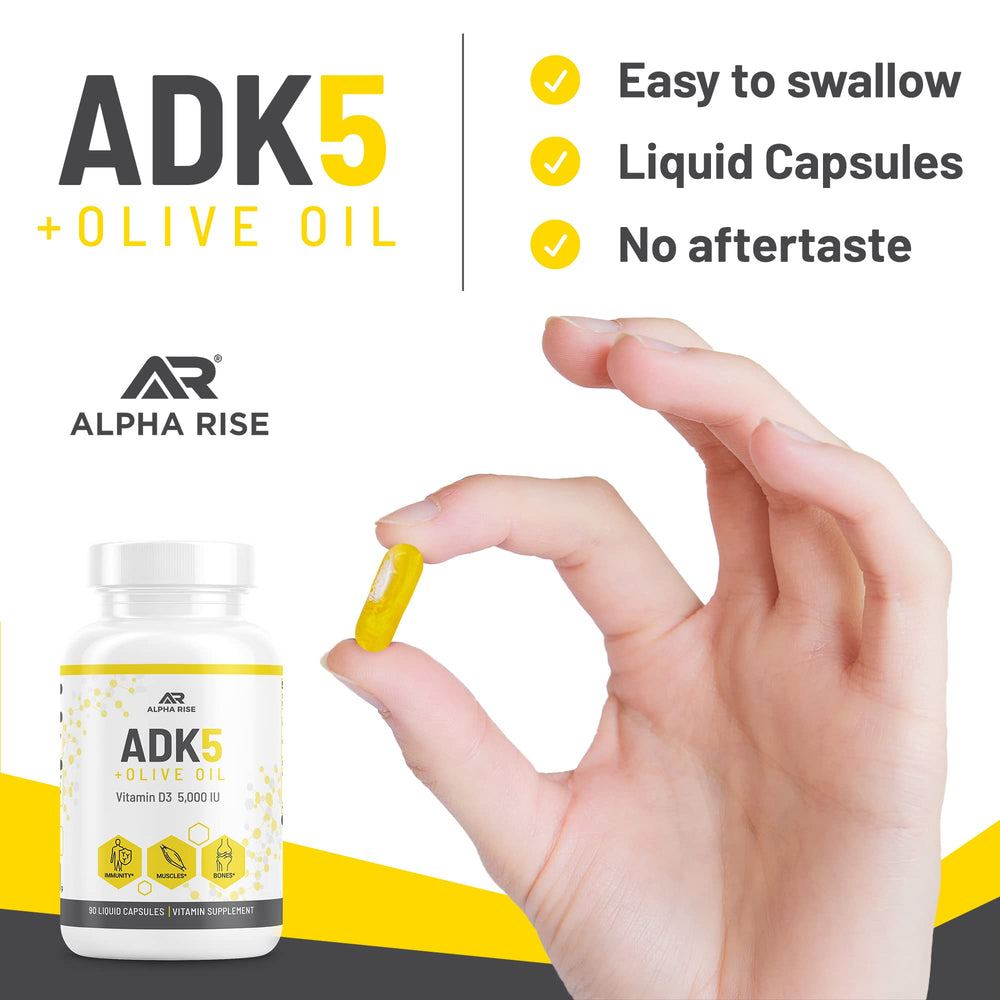 ALPHA RISE ADK bottle beside olive oil suggests absorption support.